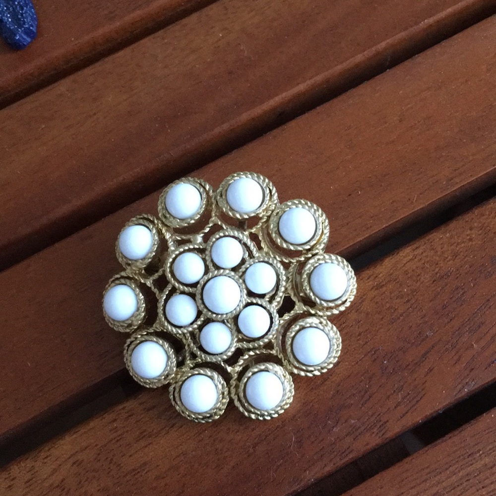 White and gold brooch